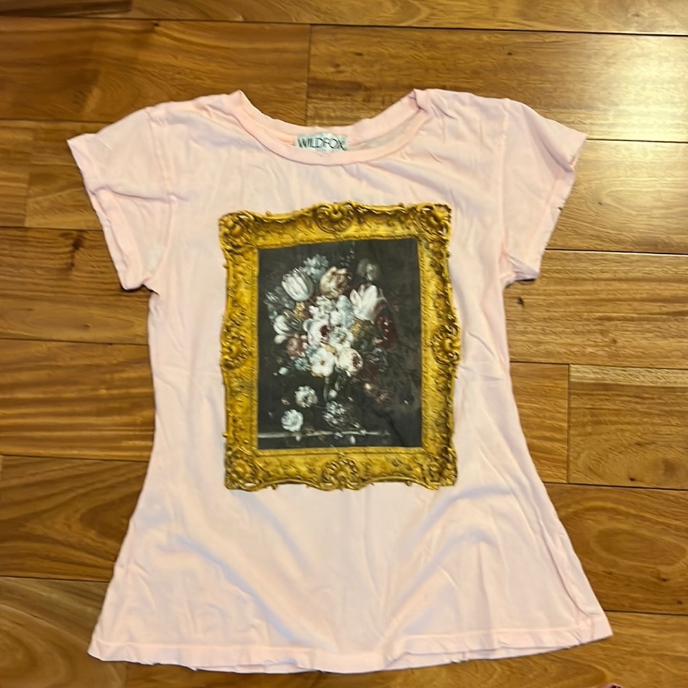 Wildfox tee made to look worn and slightly frayed. Comfy! Never worn! Size small